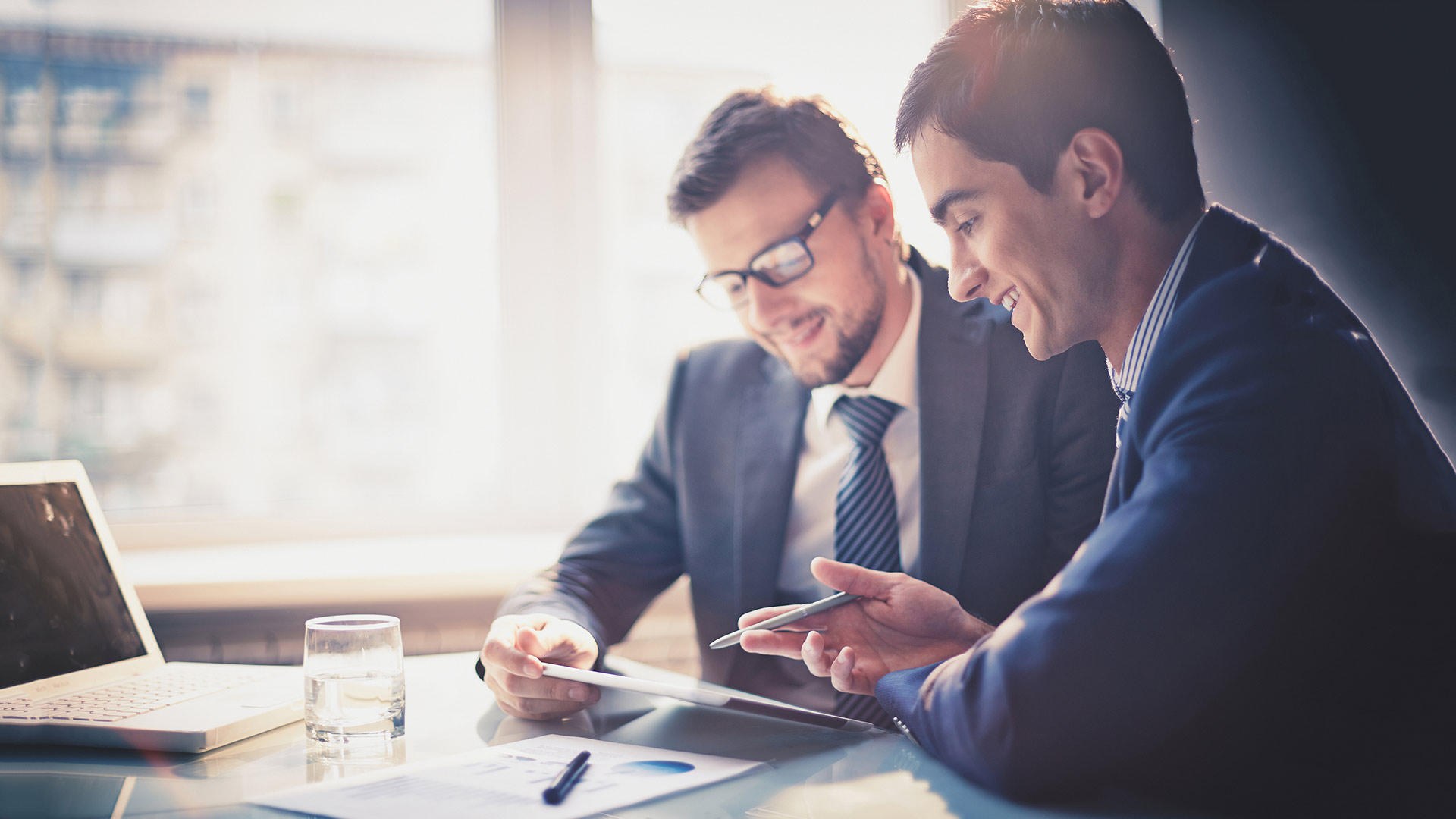 Two consultants reviewing a report